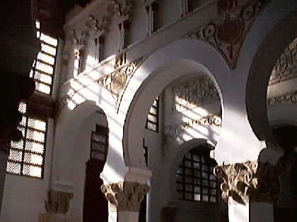 The synagogue itself is not chiaroscuric. The interplay of light and shadows, however, is.